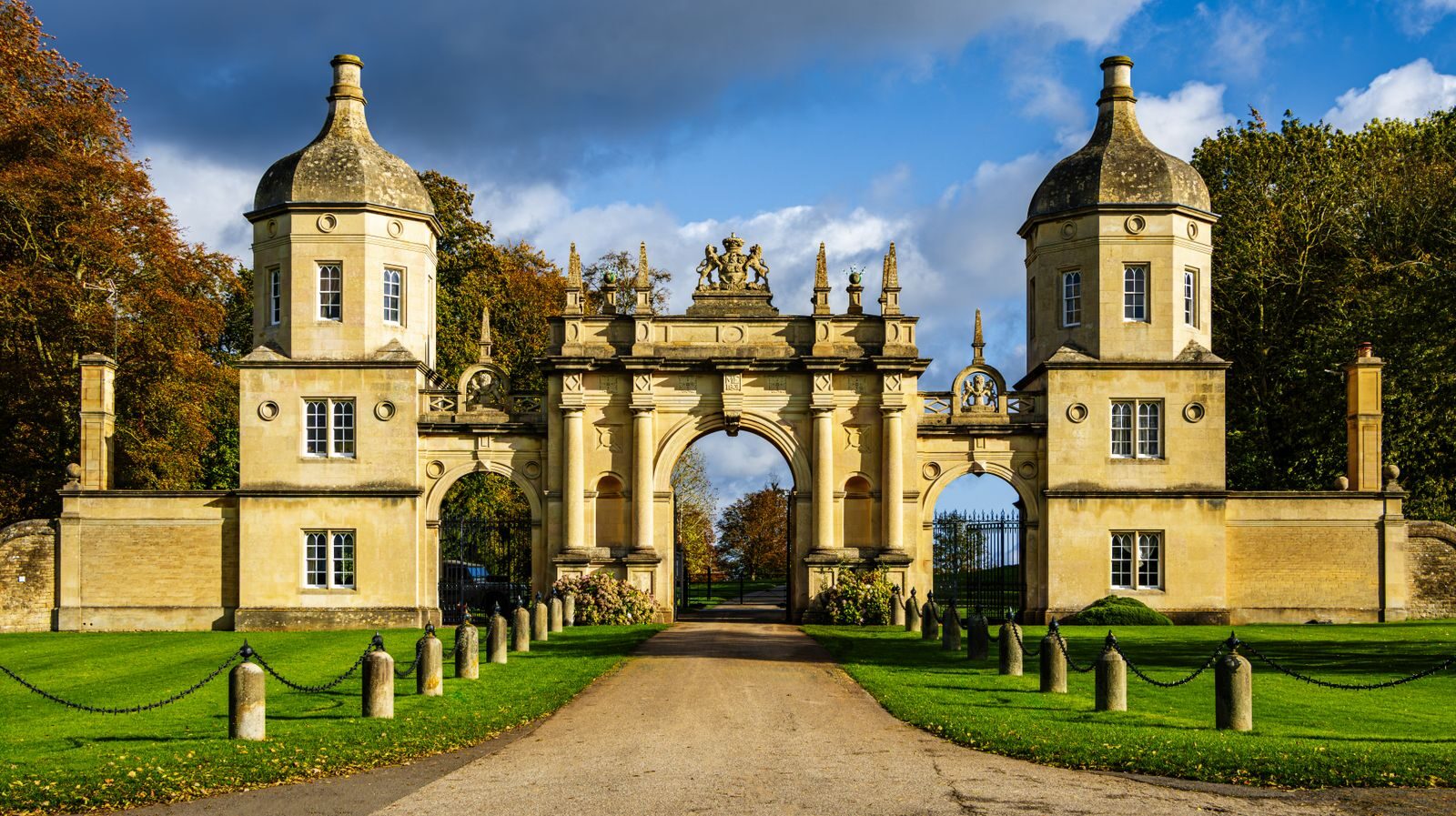 Photo by Mark A Jenkins Grand entrance gate in Peterborough surrounded by lush greenery.