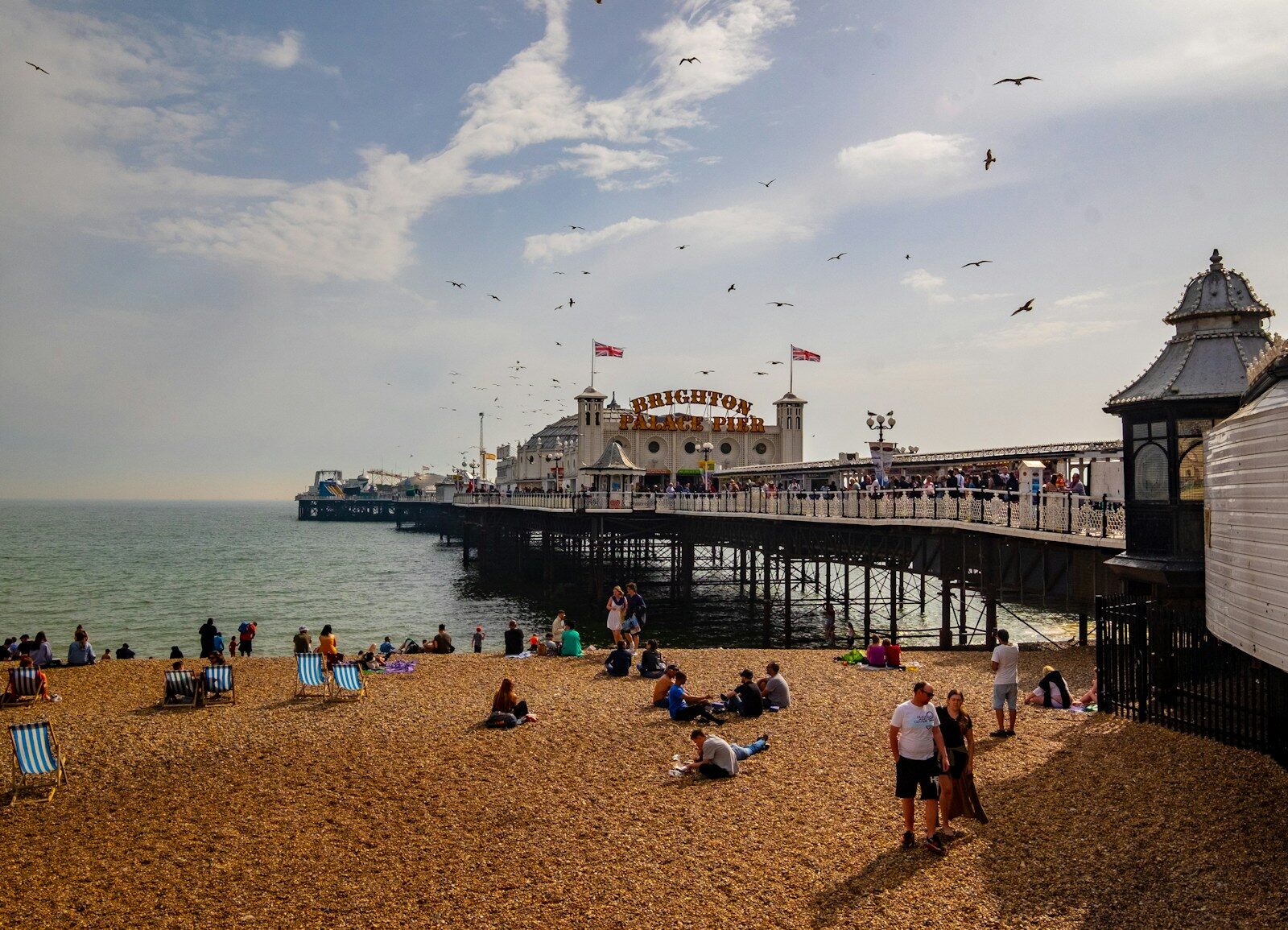 Photo by Ben Guerin people near seashore viewing sea